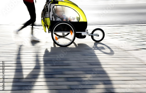 moyther with yellow pram photo