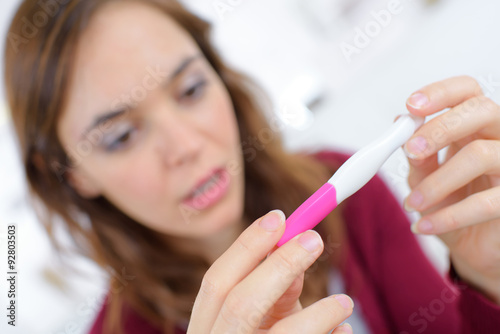 Holding a pregnancy tester