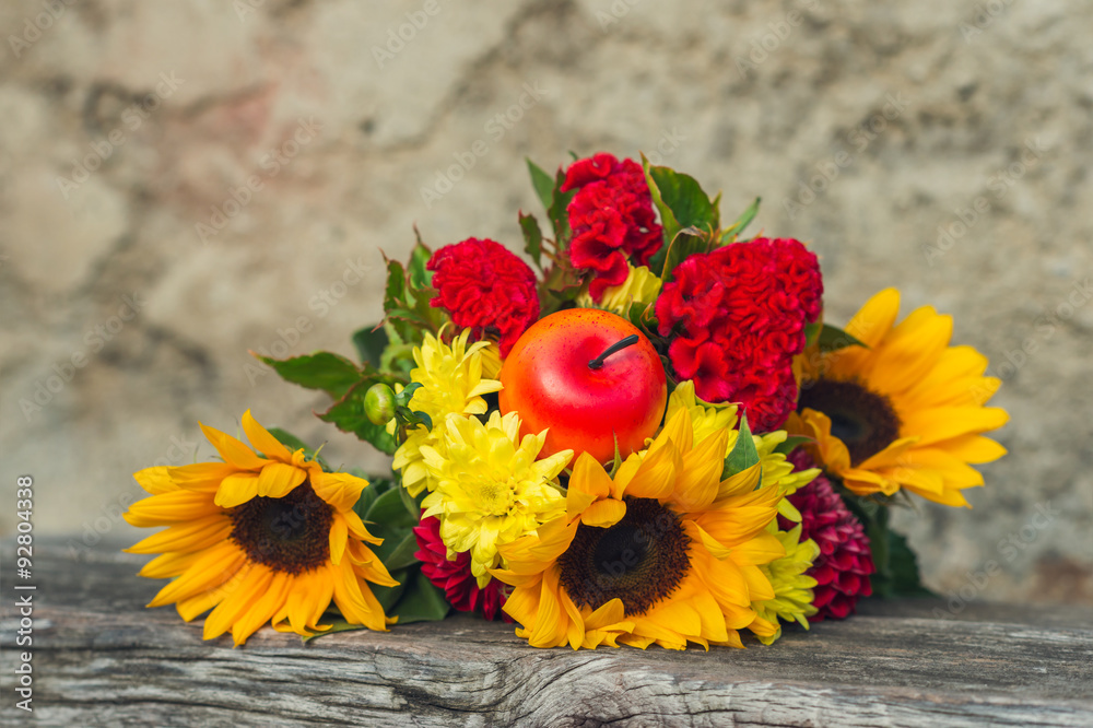 Autumn bouquet of sunflowers and red cockscombs