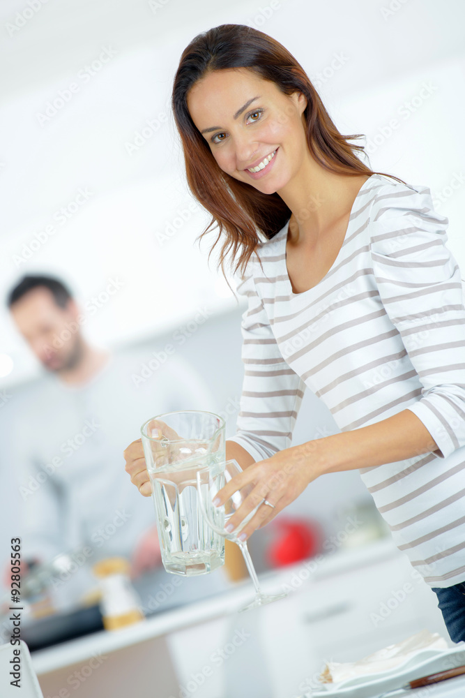 Woman setting the dining table