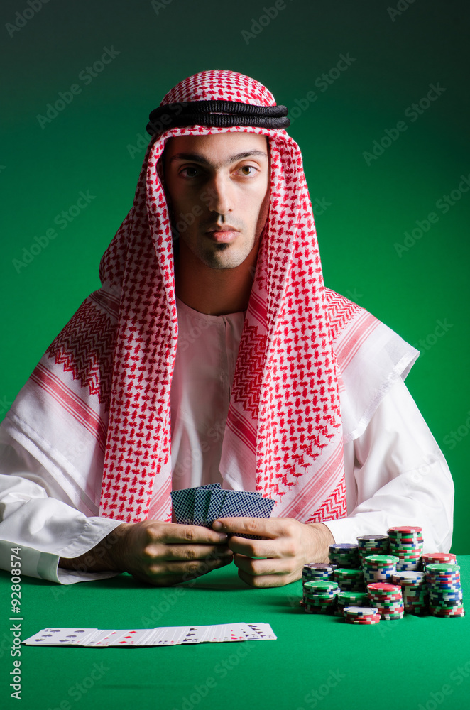 Arab man playing in the casino