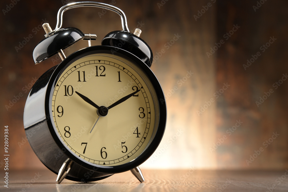Composition with old black alarm clock. Composition with old black alarm clock.