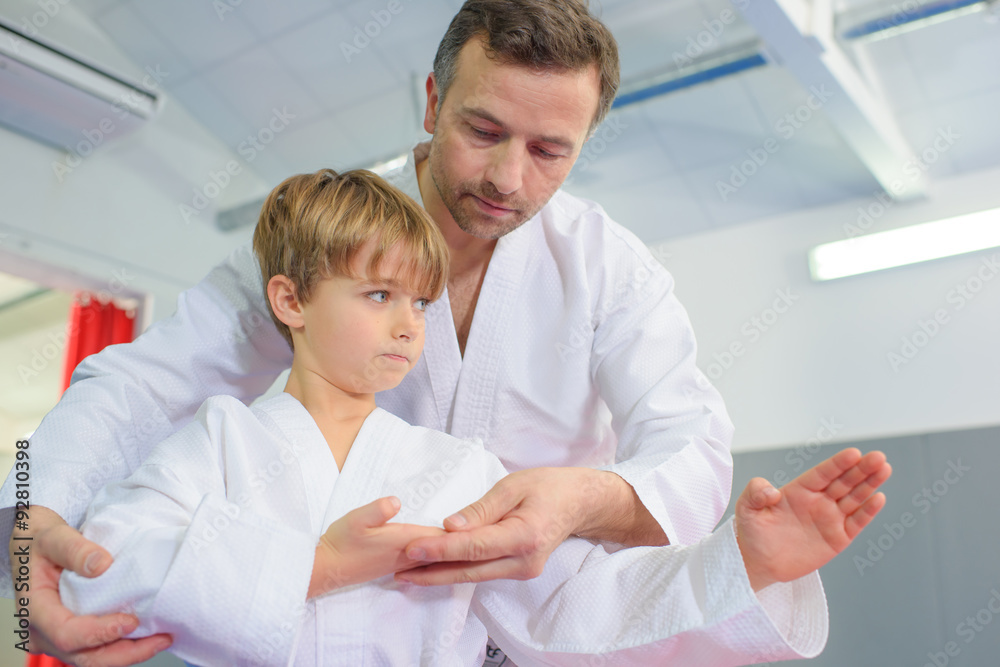 Little boy in a karate lesson Little boy in a karate lesson