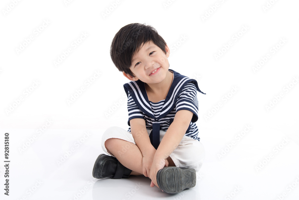 Happy asian boy sitting on white background Happy asian boy sitting on white background
