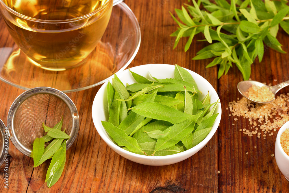 Lemon verbena leaves and tea on table. Lemon verbena leaves and tea on table.