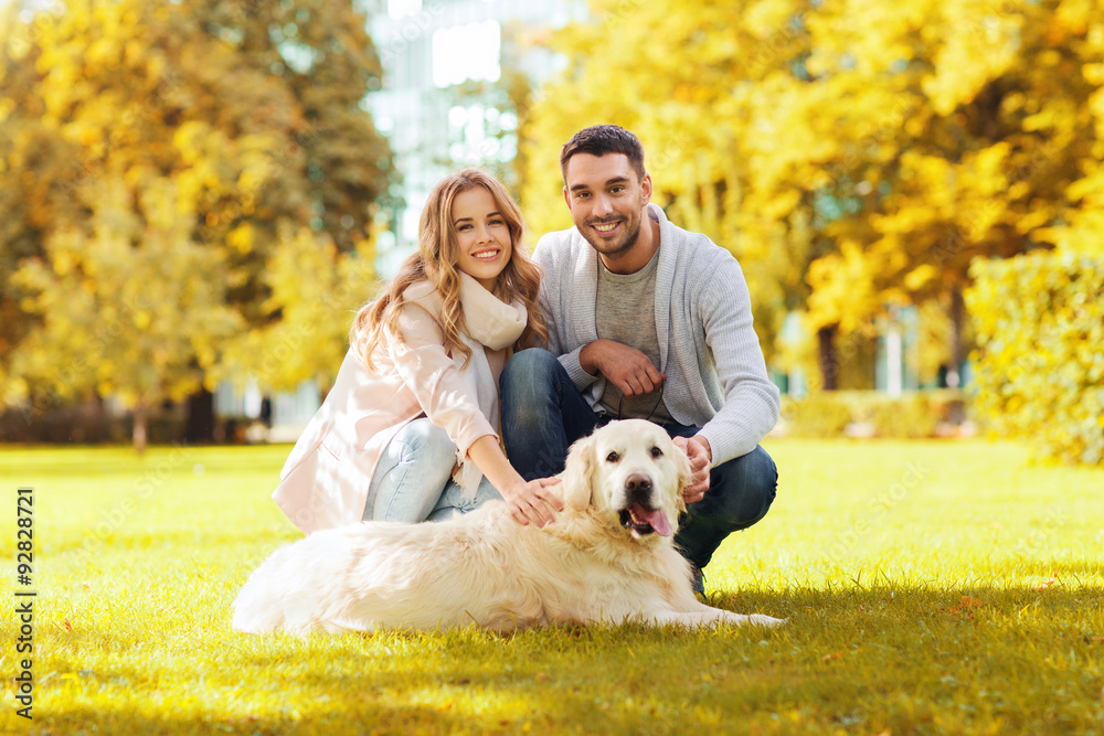 happy couple with labrador dog autumn in park happy couple with labrador dog autumn in park