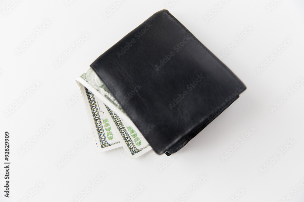 close up of dollar money in black wallet on table close up of dollar money in black wallet on table