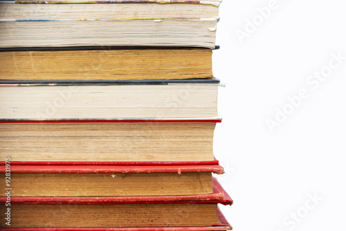Pile of old vintage books isolated on white background