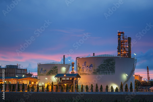 Petrochemical industrial plant, Oil and Gas refinary with smoking in twilight sky photo