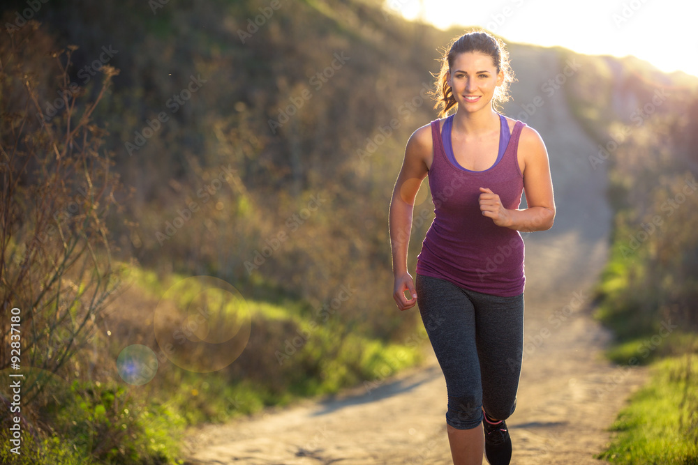 Beautiful attractive woman morning sunset sunrise jog walk hike outdoors exercise burning calories Beautiful attractive woman morning sunset sunrise jog walk hike outdoors exercise burning calories