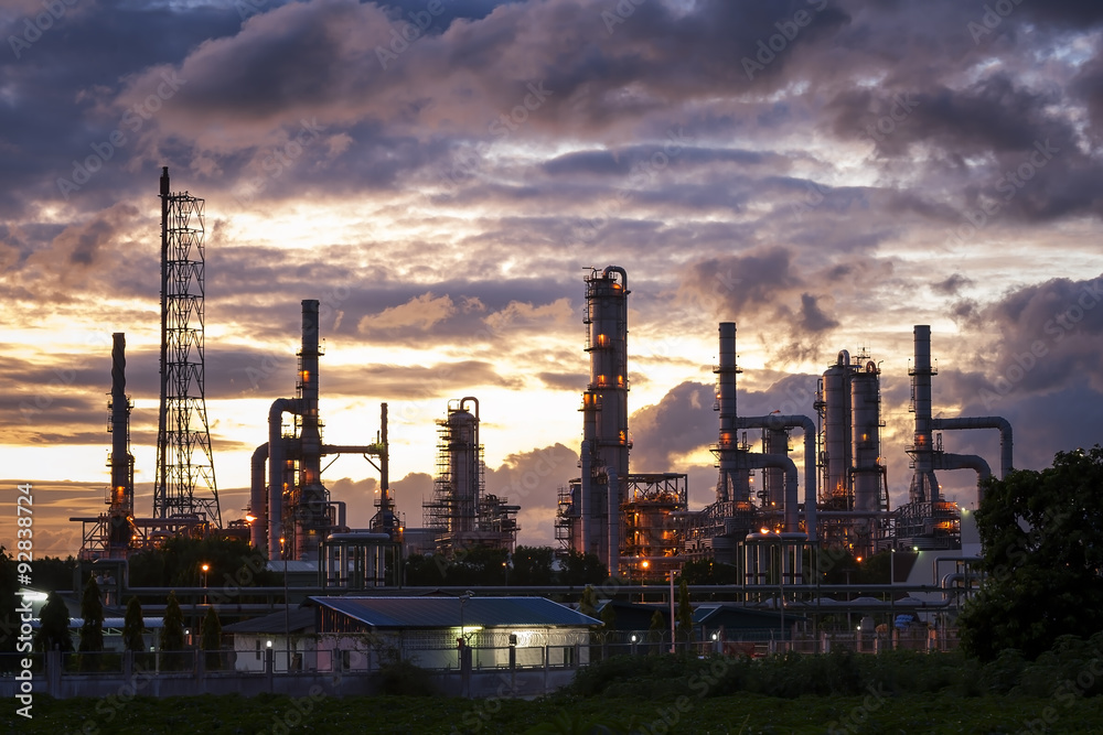 Silhouette of petrochemical plant, Oil and Gas refinary in sunrise