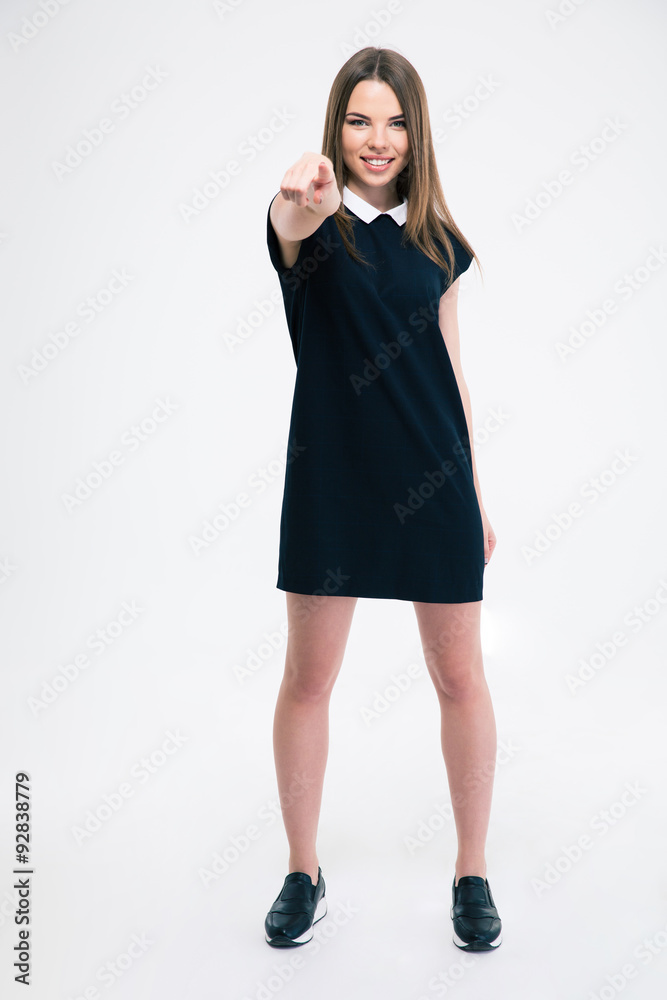 Smiling woman pointing finger at camera Smiling woman pointing finger at camera