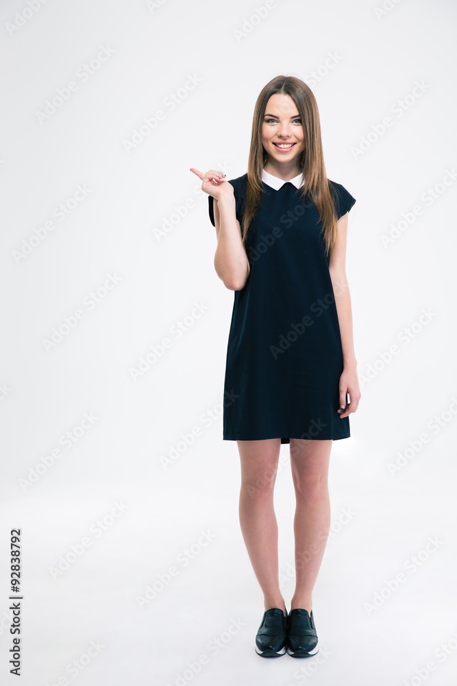 Smiling woman pointing finger away Smiling woman pointing finger away