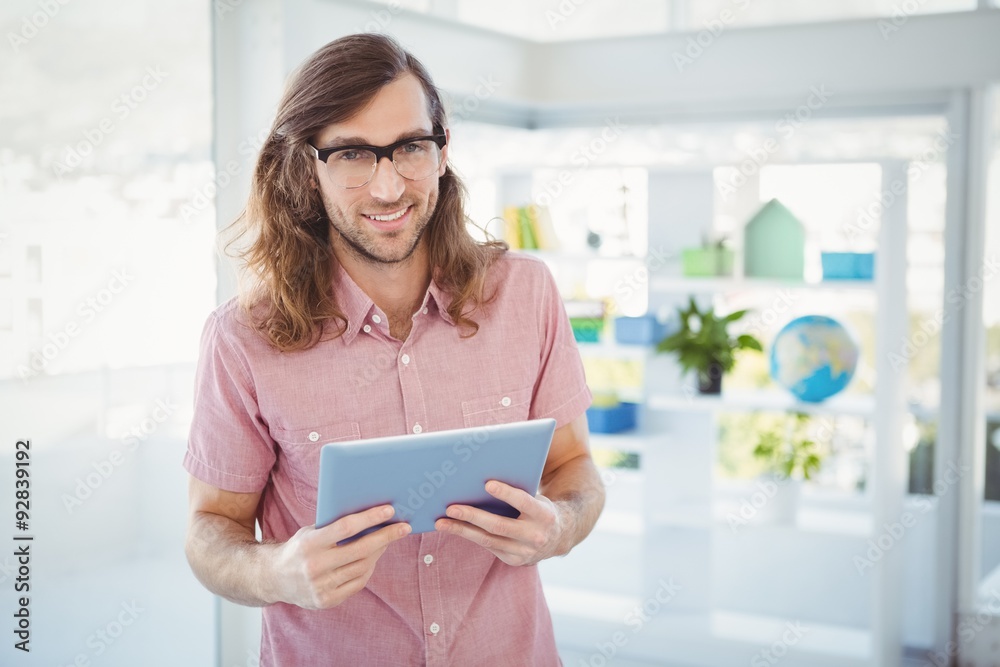 Portrait of confident hipster holding digital tablet Portrait of confident hipster holding digital tablet