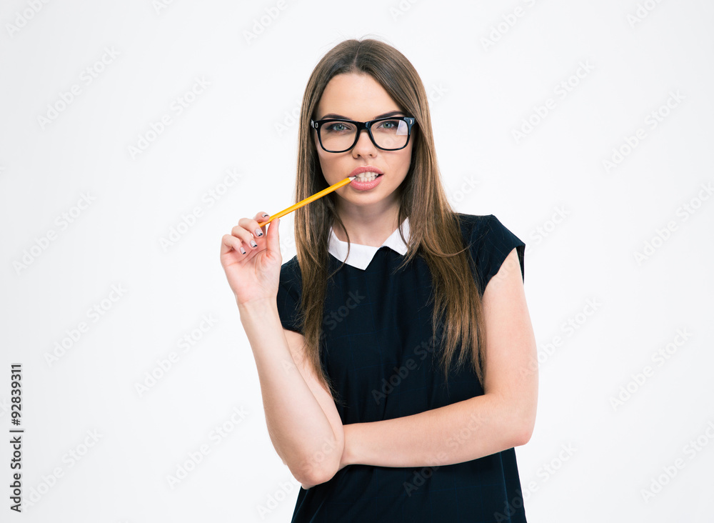 Portrait of a thoughtful young girl holding pencil