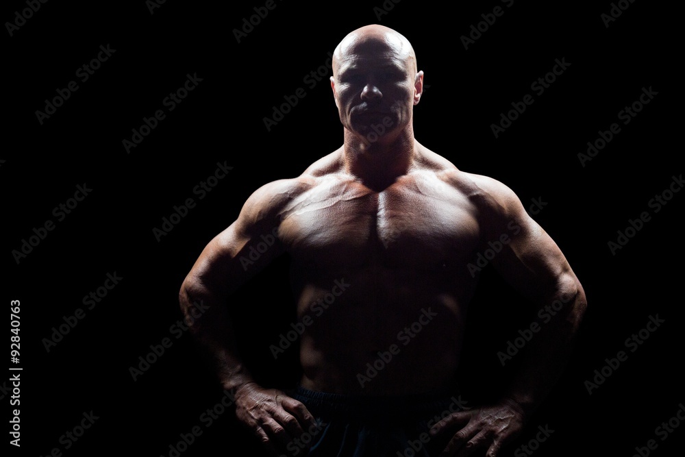 Fototapeta premium Portrait of muscular man with hands on hip