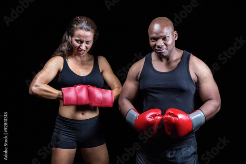 Portrait of male and female boxers with gloves