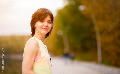 woman with mp3 player doing fitness