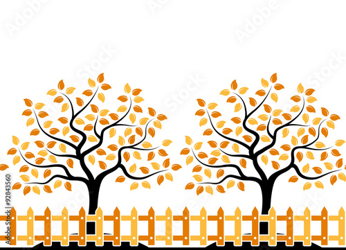 autumn trees behind fence border