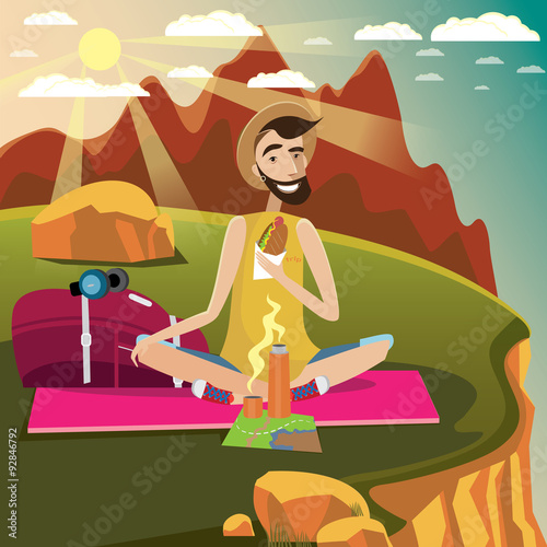 Backpacker rests on a grassland in the mountains