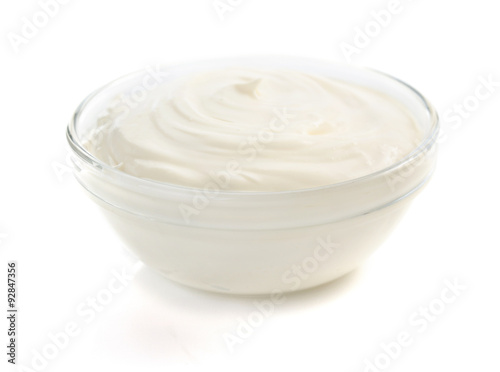 sour cream in bowl on white