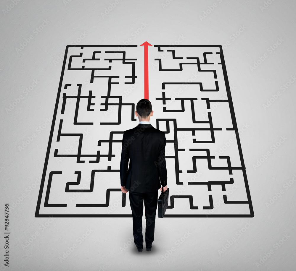 Business man thinking maze solution Business man thinking maze solution
