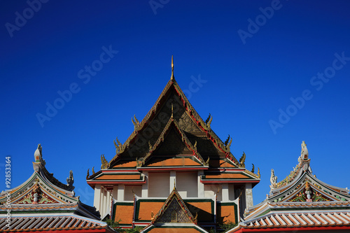 Rooftop of Buiddhist temple in the blue sky