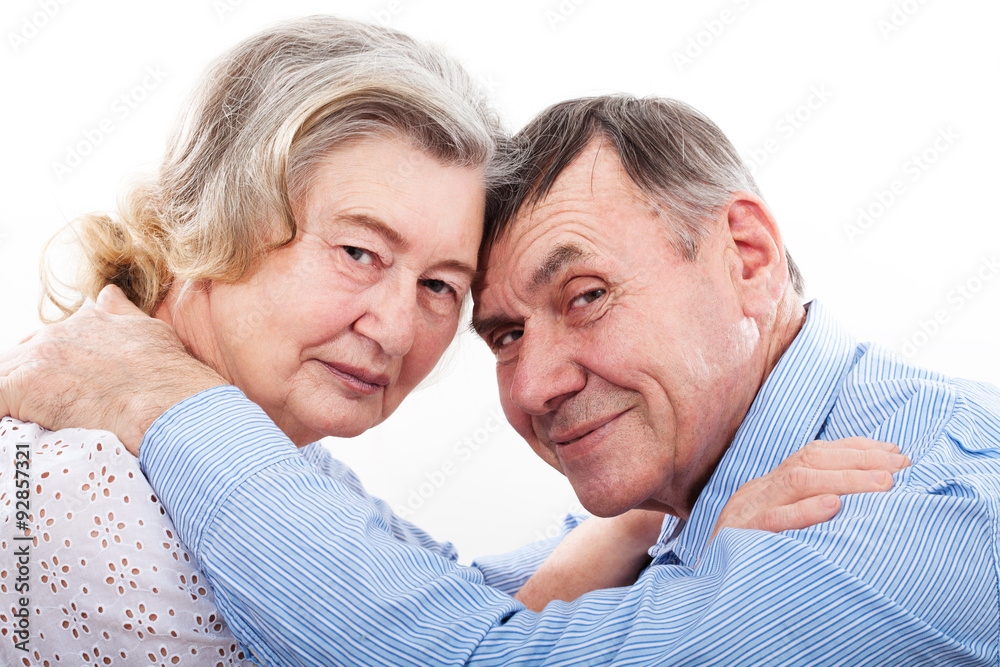 Closeup portrait of smiling elderly couple