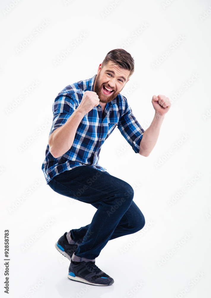 Happy casual man celebrating his success Happy casual man celebrating his success