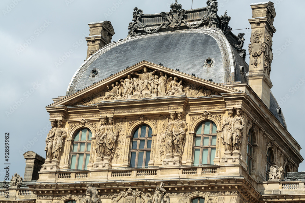 Fototapeta premium Paris - The Louvre Museum. Louvre is one of the biggest Museum in the world, receiving more than 8 million visitors each year.