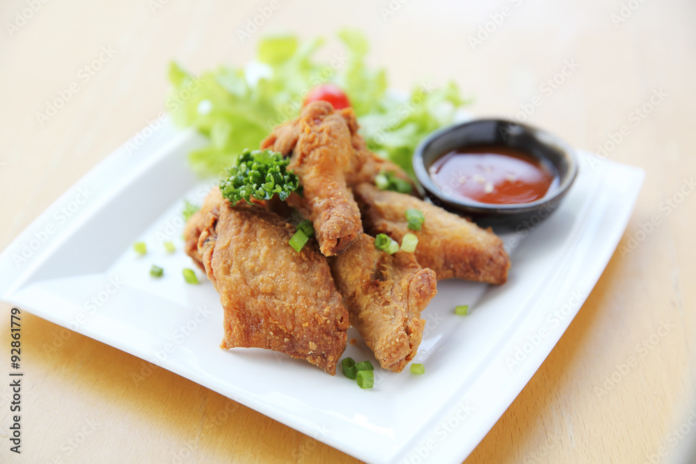 Fried chicken on wood background