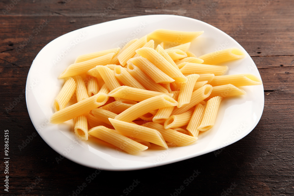 Plain Boiled Penne Pasta on White Dish Plain Boiled Penne Pasta on White Dish