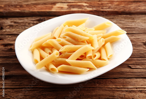 Plain Boiled Penne Pasta on Rustic Wooden Table