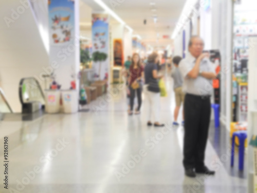 Blurred image of people walking at shopping mall 