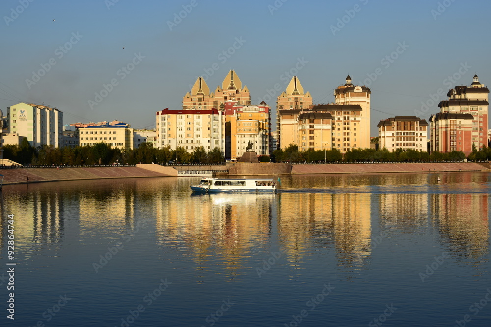 Modern buildings in Astana, Kazakhstan, reflected in the Ishim river