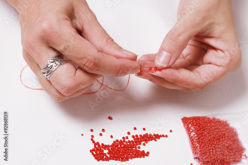 Stringing beads on a needle
Нанизывание бисера на иголку photo