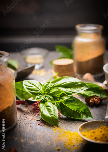 bunch of basil on a background of herbs and spices  close up