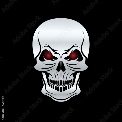 silver skull with red eyes on black background