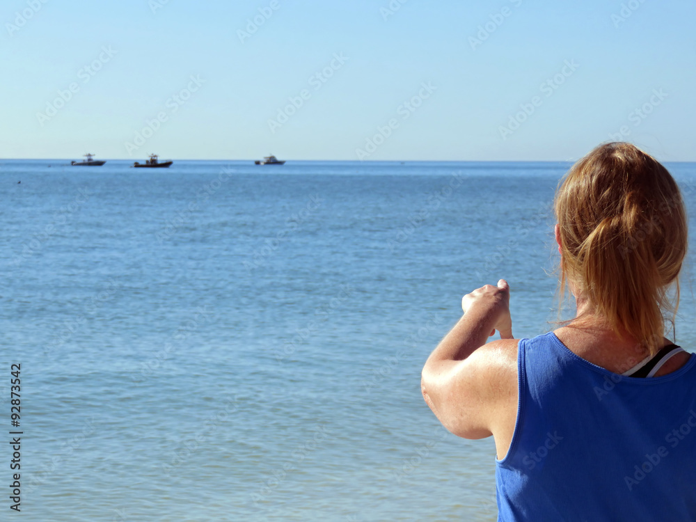 Woman Pointing to Ships at Sea Sanibel Florida