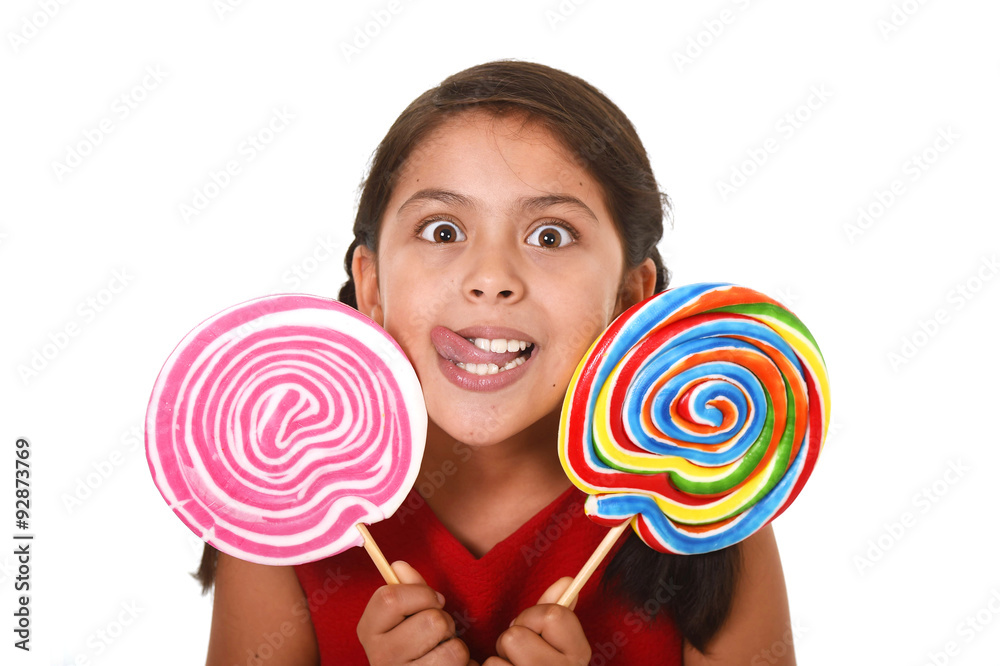happy female child holding two big lollipop in crazy funny face expression in sugar addiction