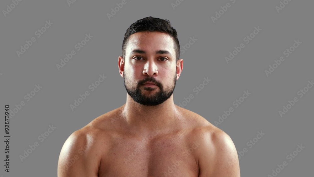 Serious muscular man lifting kettlebell Serious muscular man lifting kettlebell