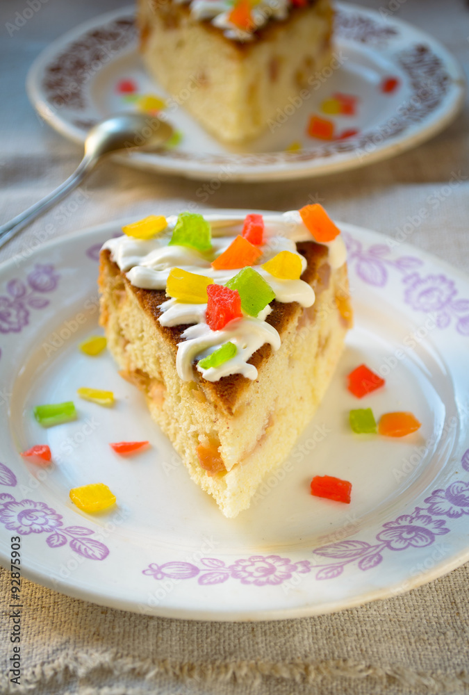 Celebration cake with vanilla sause, decorated candied fruits Celebration cake with vanilla sause, decorated candied fruits