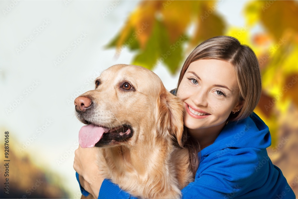 Hugging a dog.