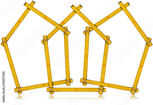 Houses - Wooden Folding Rulers / Three wooden yellow meters in the shape of houses, isolated on white background. Design house concept