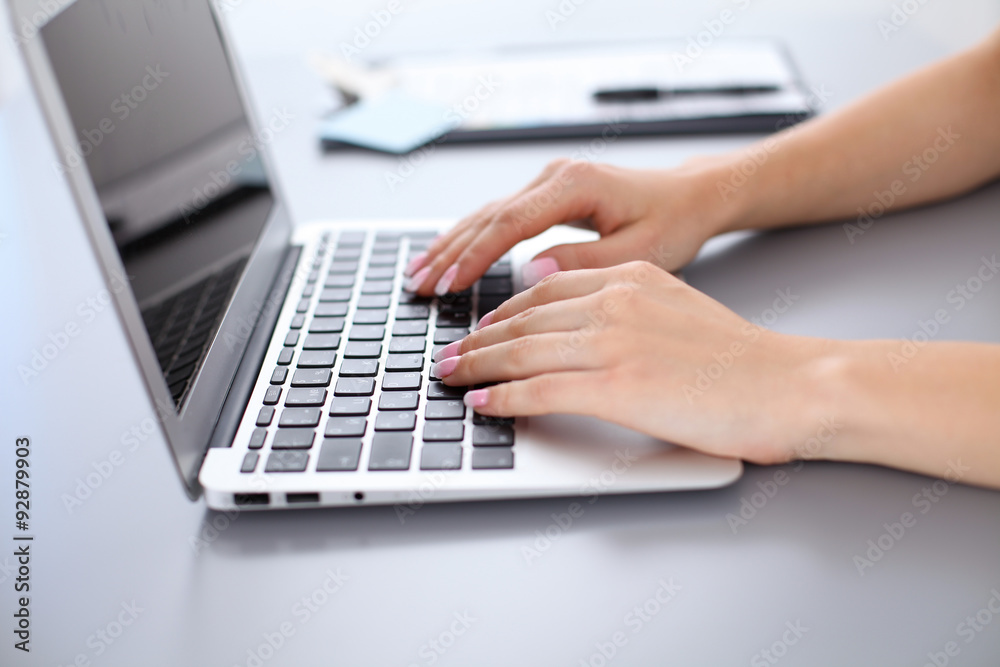 Close up of business woman hands typing on laptop computer Close up of business woman hands typing on laptop computer