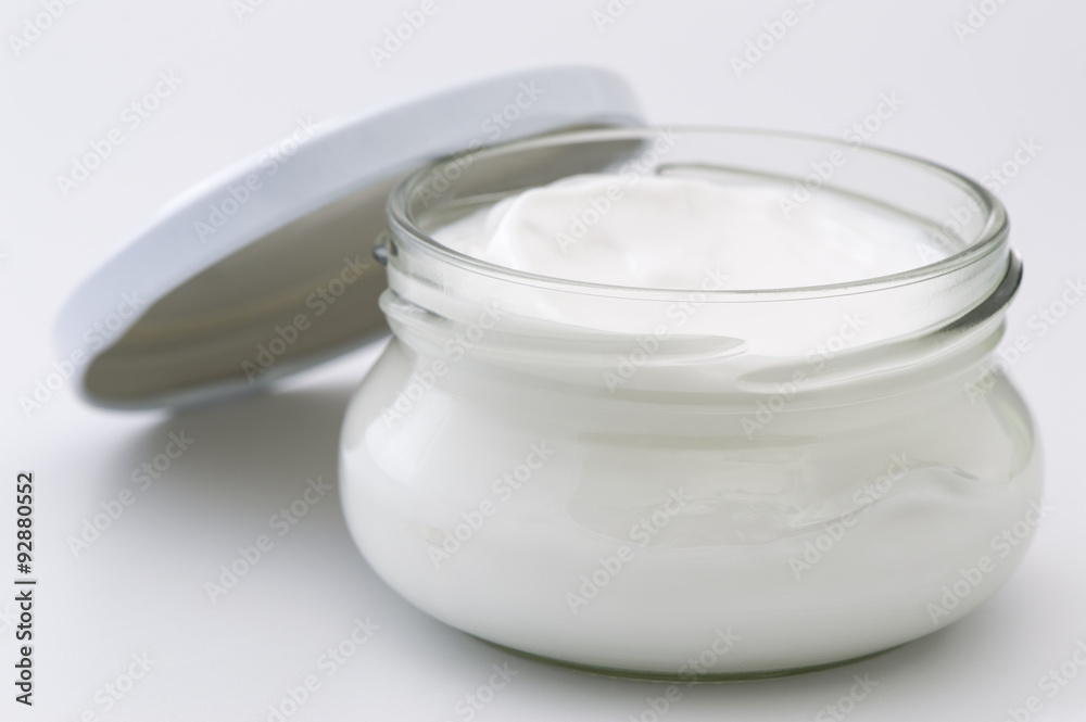 Glass jar with body cream isolated on white background Glass jar with body cream isolated on white background