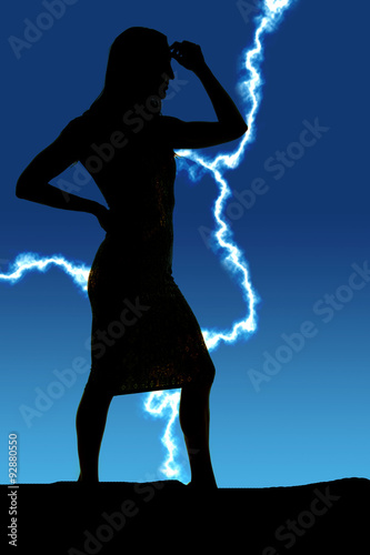 silhouette of a woman in tight dress side hand on head