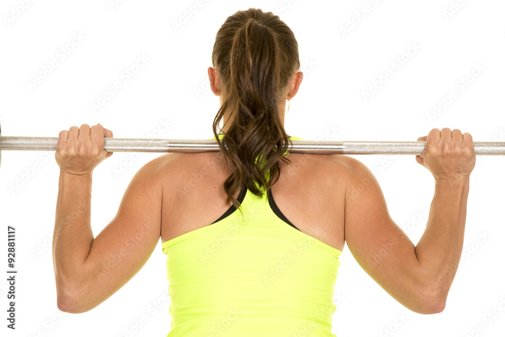woman green fitness tank top bar on back from back woman green fitness tank top bar on back from back