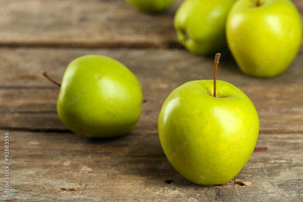 Ripe green apples on wooden table close up Ripe green apples on wooden table close up