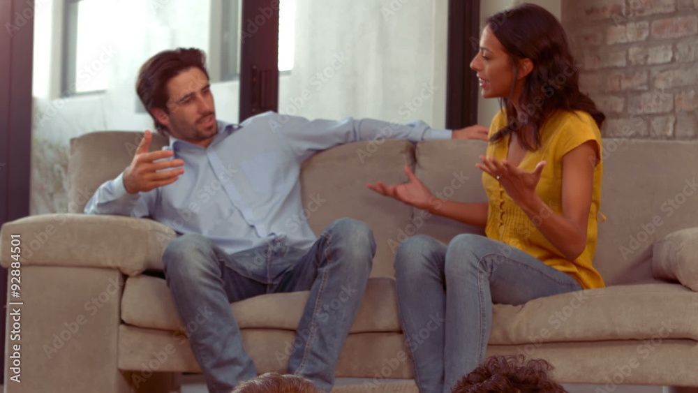 Hispanic couple disputing front of their children Hispanic couple disputing front of their children